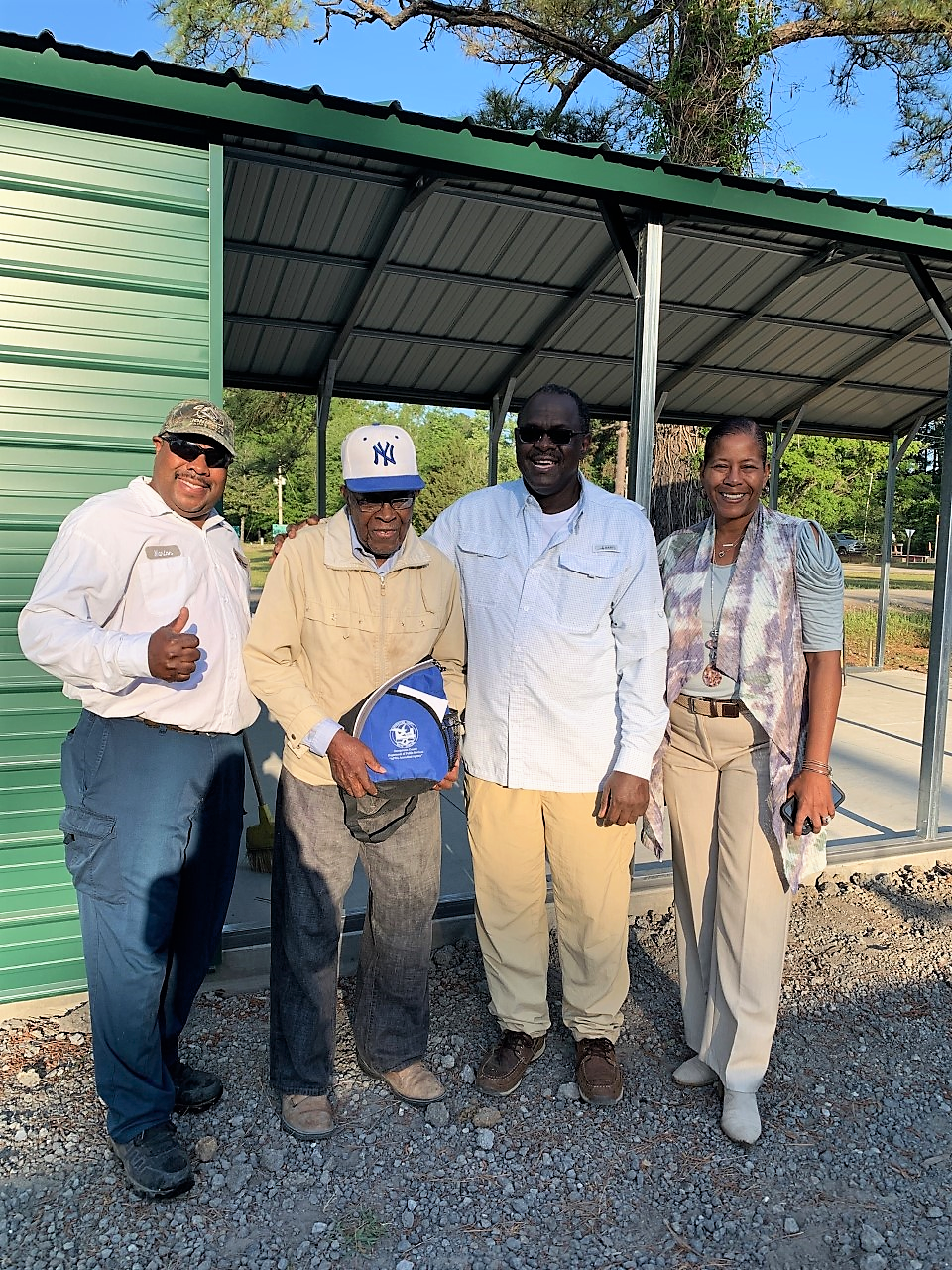 Photo of Jacob Frasier surrounded by coworkers.