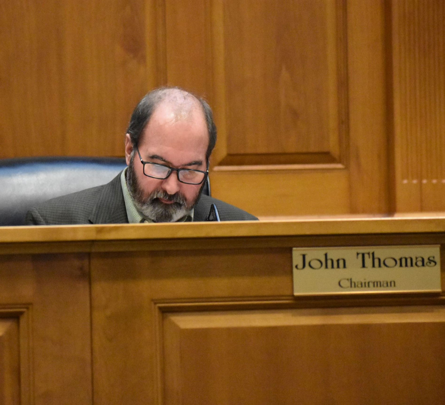 County Council Member John Thomas is pictured in the chairman's seat