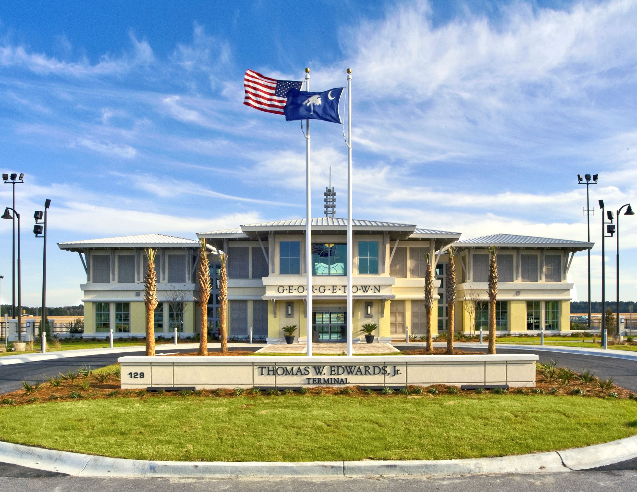 A photograph of the main terminal of the Georgetown County Airport on a sunny, breezy day.