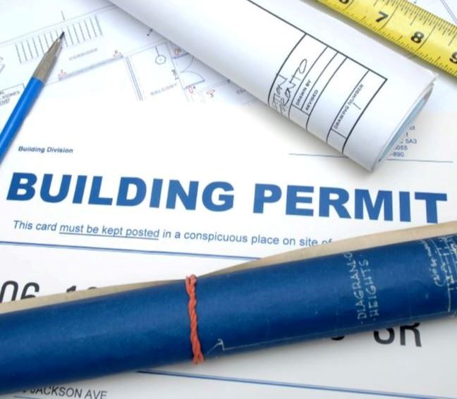building permit and tape measurer
