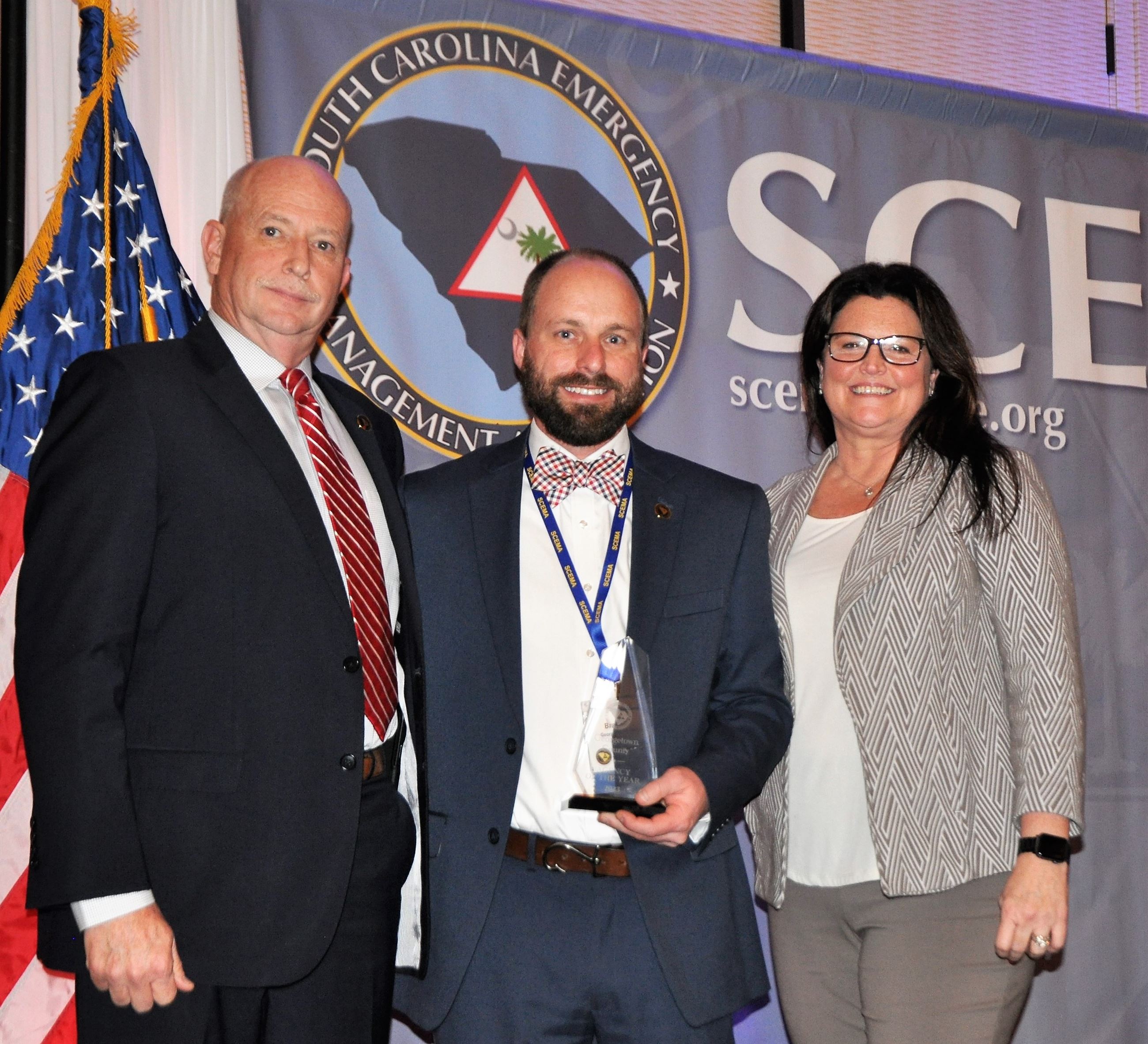 Brandon Ellis, center, accepts the award on behalf of Georgetown County Emergency Management. 