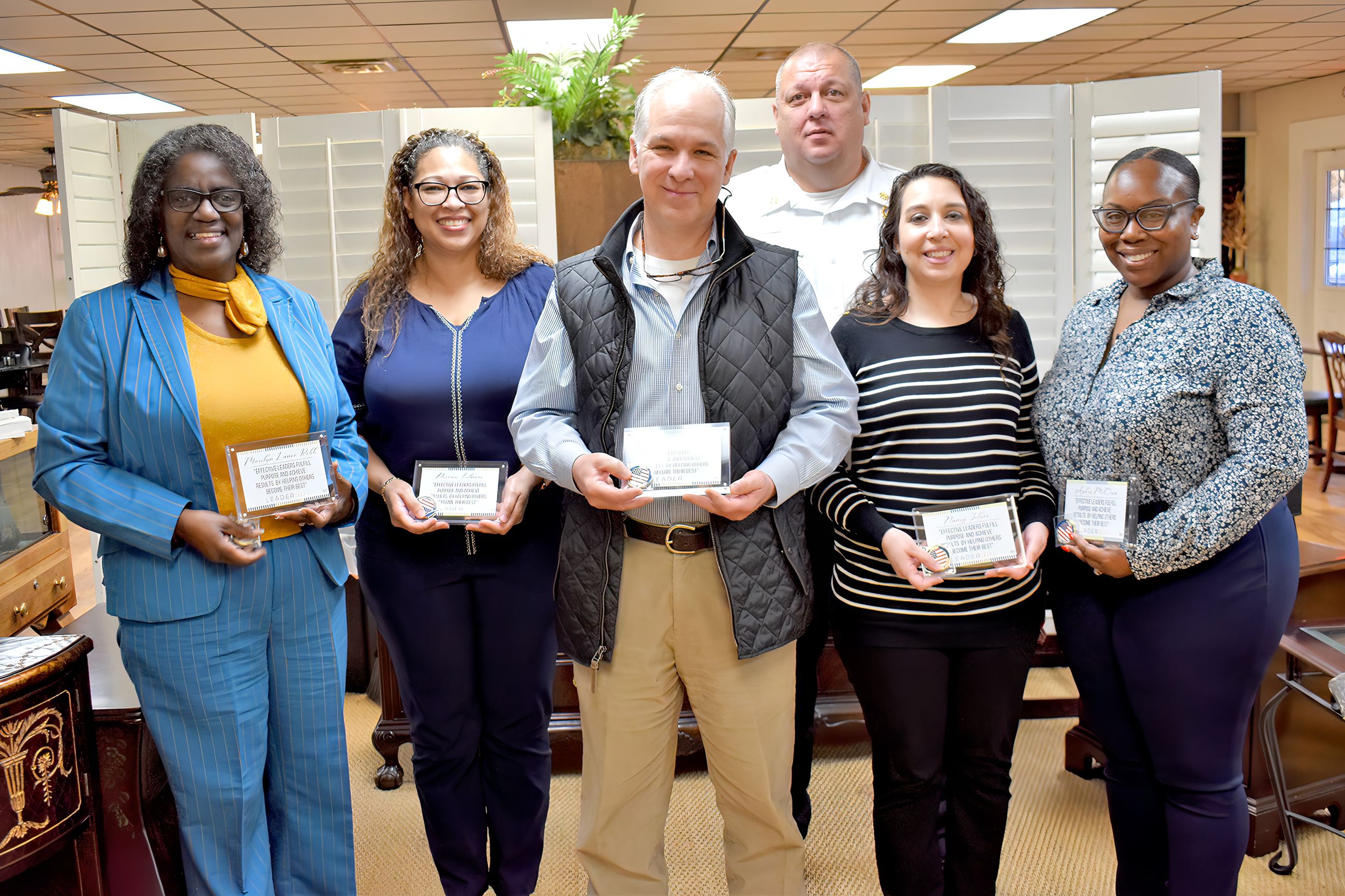Six people holding placards