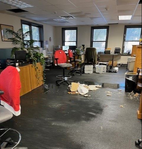 flooding in the Treasurer's Office with water still pooling on the floor