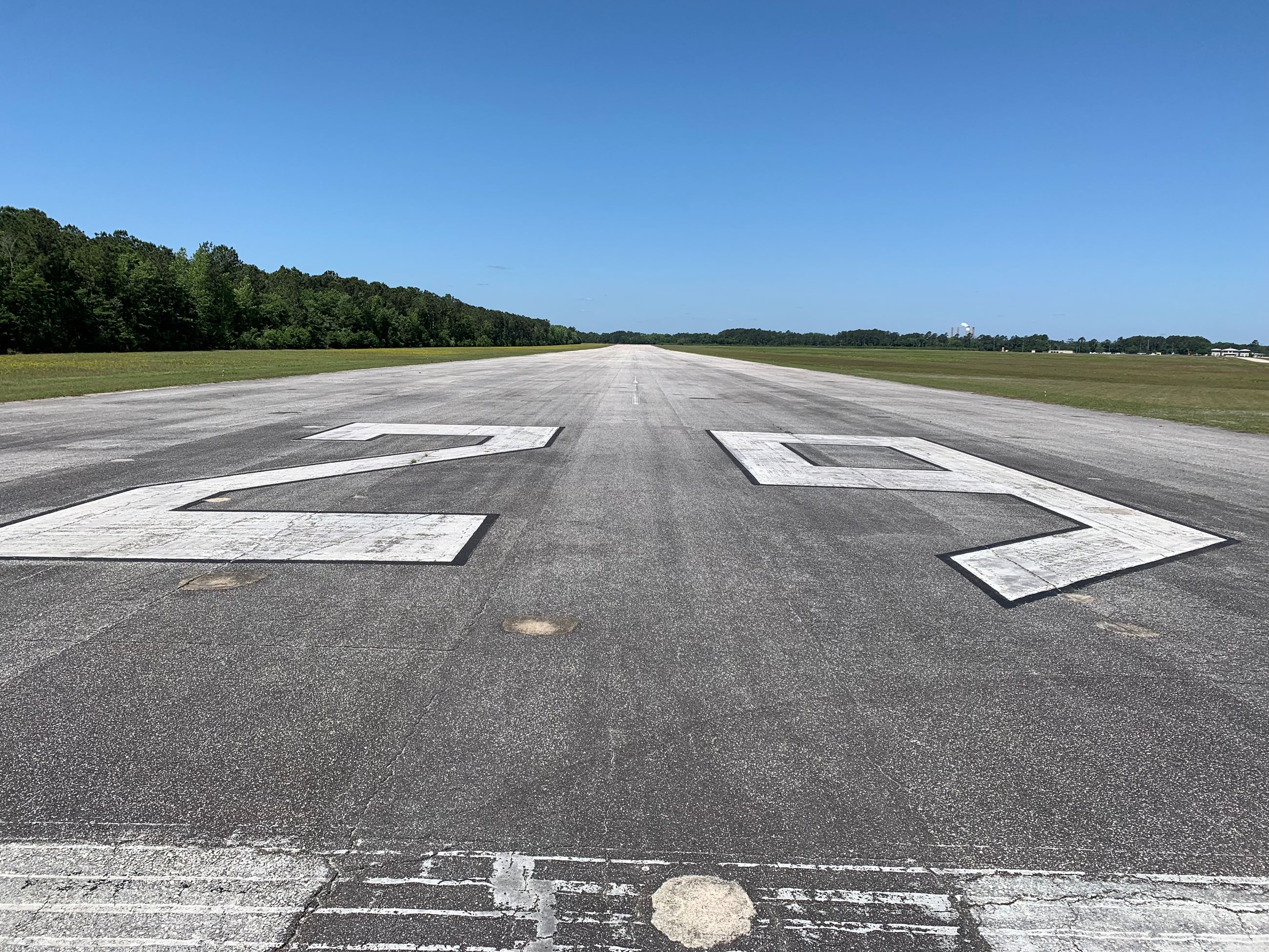potholes are visible in an image of runway 11/29