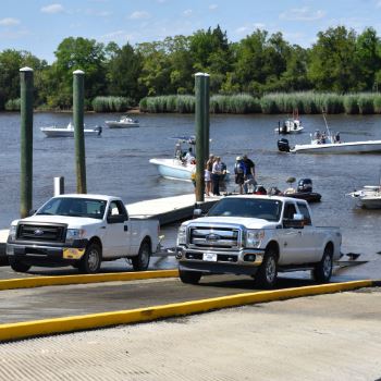 trucks accessing marina with boats
