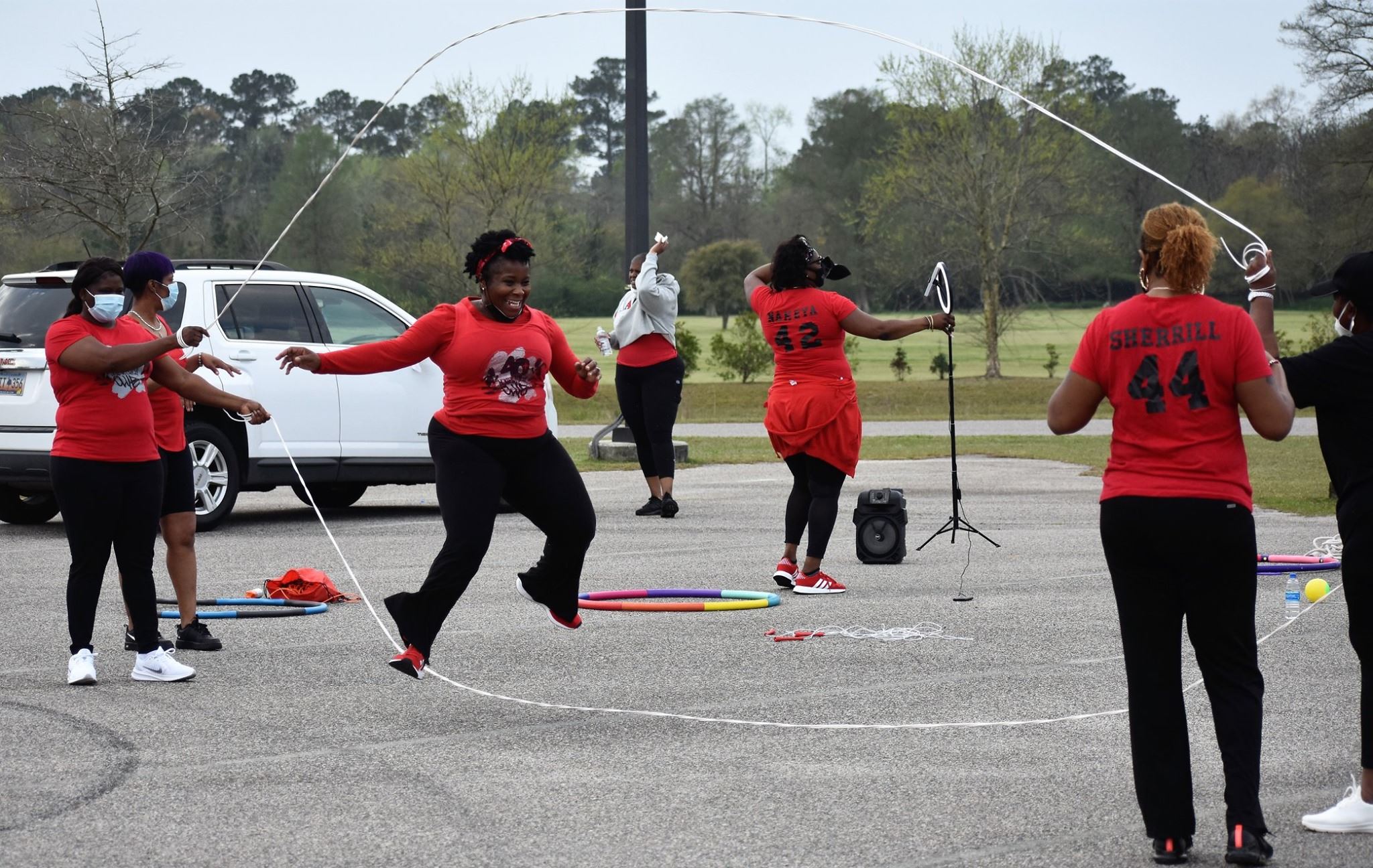 A woman in a red shirt jumps double dutch at the Carrol Campbell Marine Complex